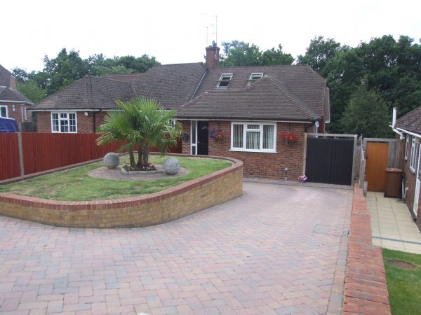 NASH MILLS - Situated on the Kings Langley borders this extended 1950s semi detached four bedroom chalet style bungalow is offered exclusively through Michael Anthony with accommodation comprising; entrance hall, two bathrooms, bedrooms one and two, kitchen, dining room, lounge area, cloakroom, bedrooms three and four, mature gardens to rear and�off road parking to front.� Viewing highly recommended. - FRONT